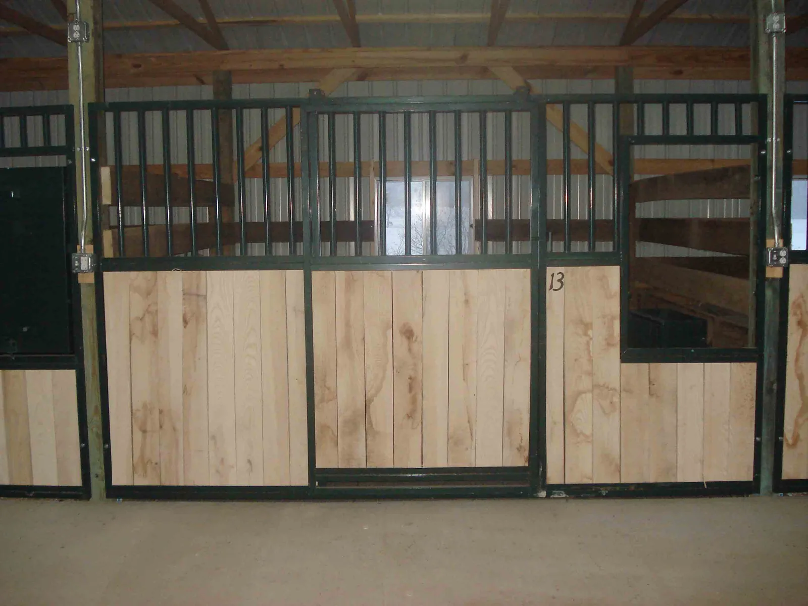 Outside of a matted 12x12 stall at Bittersweet Acres
